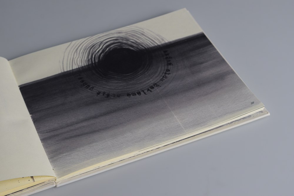 Abstract ink spiral composition paired with its source text