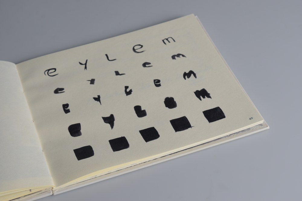 Letterform breaking apart into abstract ink marks, a study in incompleteness