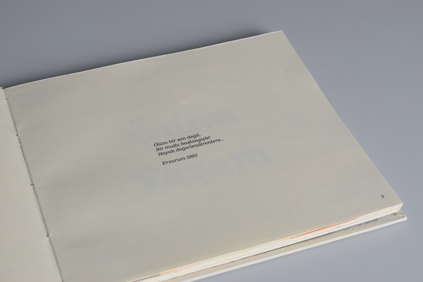 A page pairing a printed poem with a handwritten date, Erzurum 1992